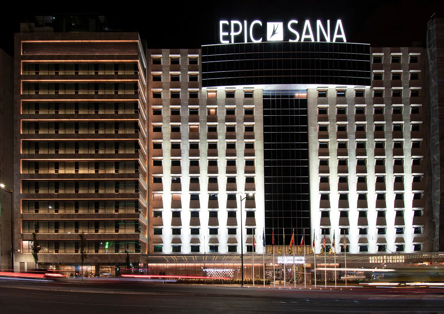 EPIC SANA Marques Hotel, the Summit's venue, lit at night.
